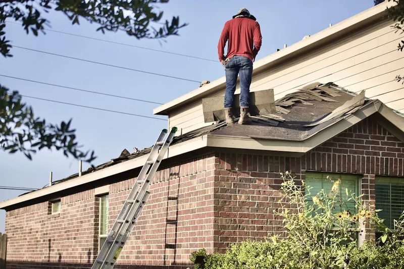 Professional roofer working on a residential roof in Edgebrook